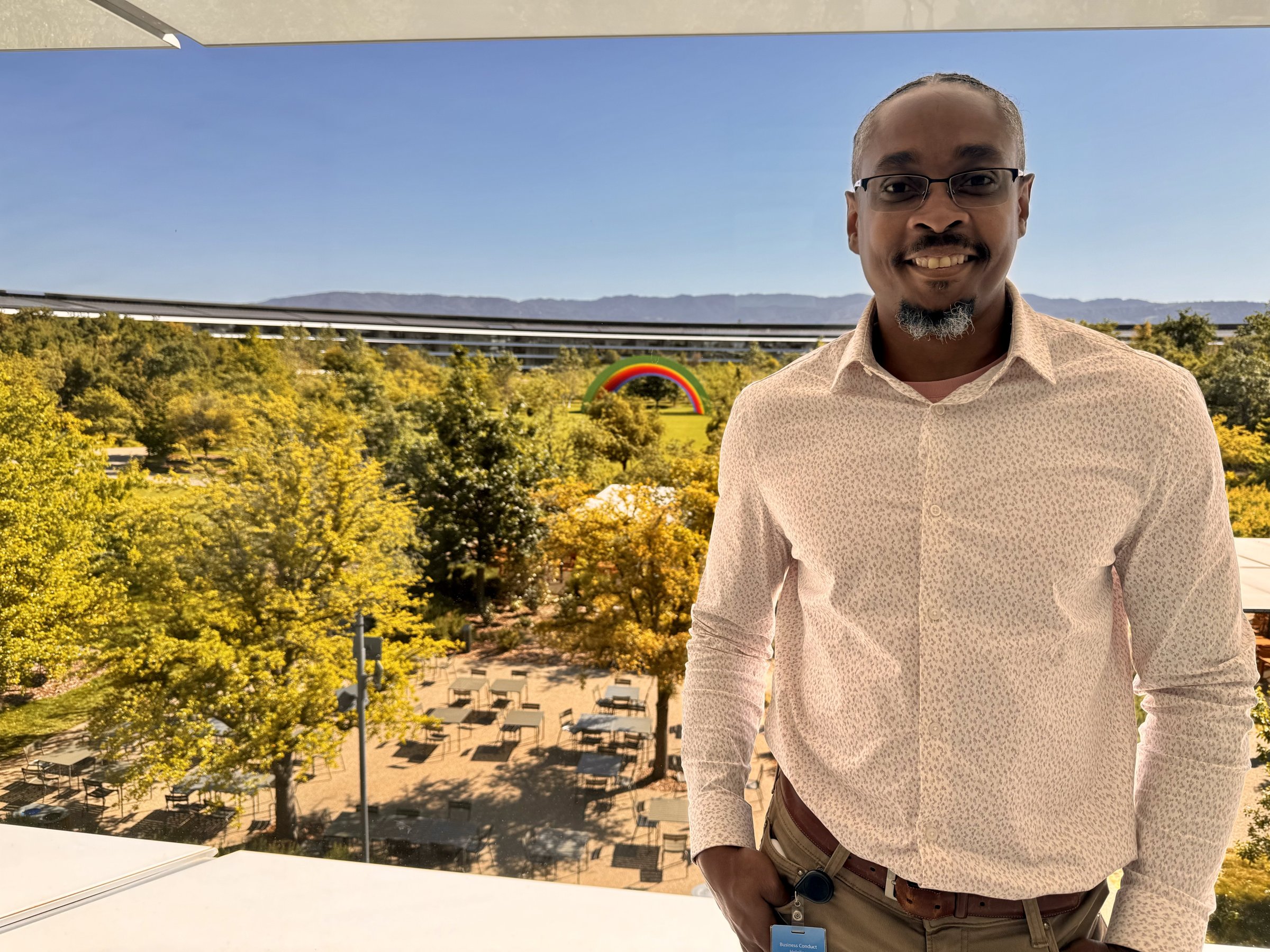 Kenan Weaver at Apple Park, the ring building visible behind him